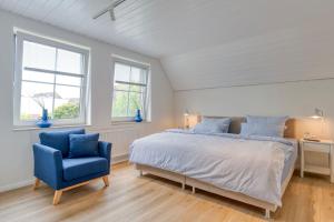 Postel nebo postele na pokoji v ubytování Lüttje Ginsterhuus - Ferienwohnung Käptn Pep