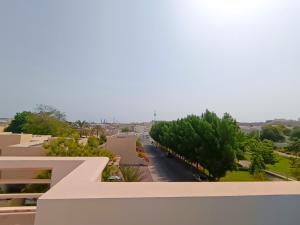 a view from the balcony of a building at Luxury 3 Bedroom Villa MSQ Muscat Parkside Retreat in Muscat