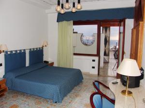 Letto o letti in una camera di Hotel Vello d'Oro