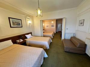 Postel nebo postele na pokoji v ubytování Le Crillon