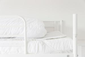 Un pat sau paturi într-o cameră la Nordliv Strand