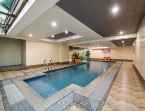 a large swimming pool in a hotel room at Close by landmarks and airport in Manila