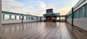 an empty building with a clock on top of it at Close by landmarks and airport in Manila