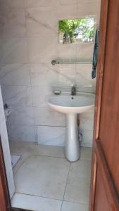 a bathroom with a white sink and a window at Halal House Vip in Qusar +16 photos