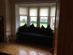 Postel nebo postele na pokoji v ubytování Sandhill House