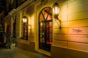 a building with a door with a light on it at Don Antonio Posada in Colonia del Sacramento
