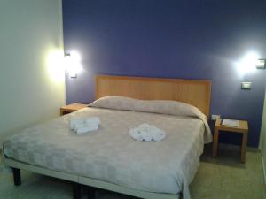 Postel nebo postele na pokoji v ubytování Hotel I Colori