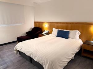 Postel nebo postele na pokoji v ubytování Hub Hotel Kaohsiung Cisian Branch