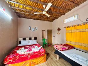 Postel nebo postele na pokoji v ubytování Shakuntala Village Resort + 72 fotografií