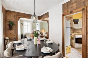 a dining room with a table and chairs at City Center Gem I Traditional Bergen Style in Bergen