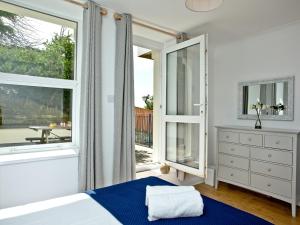 Un ou plusieurs lits dans un hébergement de l'établissement 5 Devon Beach Court