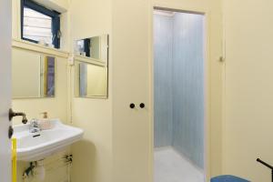 a bathroom with a sink and a shower at City Center Gem I Traditional Bergen Style in Bergen +35 photos