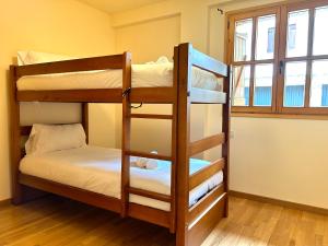 Postel nebo postele na pokoji v ubytování Apartament de muntanya i lluminós by RURAL D'ÀNEU