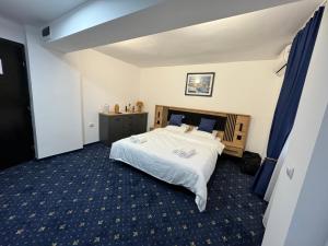 Postel nebo postele na pokoji v ubytování Hotel Hermes