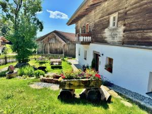 a house with a garden in front of it at Waldlerhof in Patersdorf +27 photos