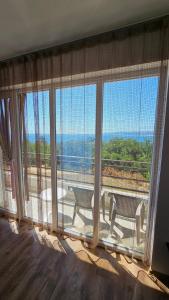 a large window with a view of the ocean at Апартаменты за гости Гавань in Byala
