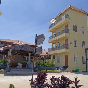 a building with a sign in front of it at Hasiru Bhoomi Resort  +42 photos