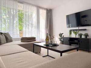 a living room with a couch and a table at Kleine BergZeit in Sankt Andreasberg