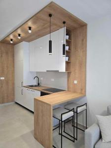 a kitchen with a table and some chairs and a counter at été 1 in Kardamaina