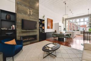 a living room with a couch and a fireplace at The Higham in Fremantle