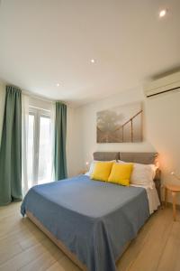 Ένα ή περισσότερα κρεβάτια σε δωμάτιο στο Marè Apartment - Housea