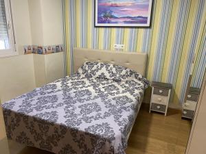 Postel nebo postele na pokoji v ubytování TERRASOL TORRELITORAL APARTAMENTO 3 DORMITORIOS DE LUJO + 12 fotografií