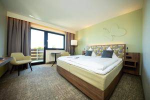 Katil atau katil-katil dalam bilik di Wohlfühlhotel DER JÄGERHOF