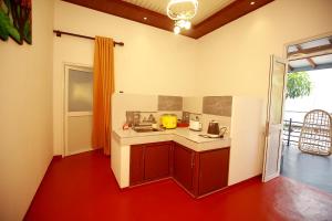 a kitchen with a sink and a counter top at Harmony Park Hiriketiya in Dickwella