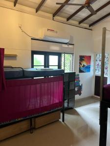 a large room with a large aquarium in it at Wake Up Weligama in Weligama