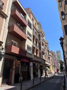 a building on a street in a city at YES! Rooms in Alicante