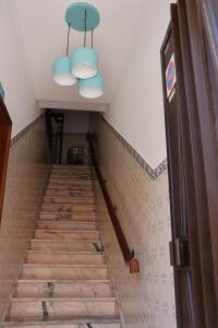 a staircase in a house with blue lights at BBA1 Appartement climatisé centre-ville Ferrel in Ferrel