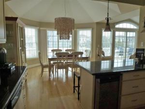 a kitchen and dining room with a table and chairs at Oceanside Brant Beach Single Family Beach Badges Private Yard Wifi Ocean And Bay Views Washer & Dryer This Home Will Allow You To Truly Feel in Brant Beach