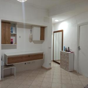 a kitchen with a sink and a mirror in a room at Nathally room's Gandía in Gandía
