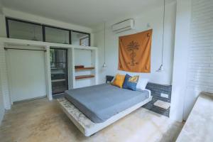 Ένα ή περισσότερα κρεβάτια σε δωμάτιο στο REZ SPACE Apartment 05