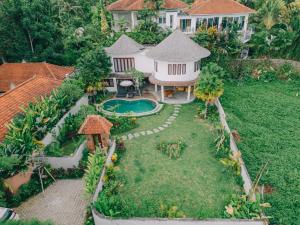 an aerial view of a house with a yard at 3 Bedroom Gadang Villa Ubud in Ubud