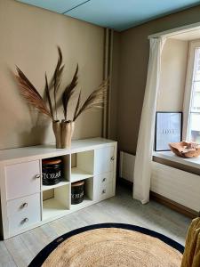 a room with a white cabinet and a window at Hygge Style Apartment in Steckborn