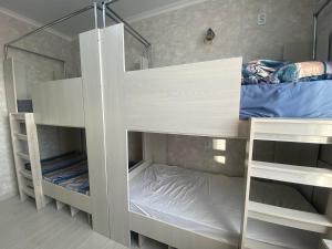 a couple of bunk beds in a room at Friendly in Astana +5 photos