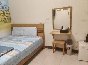 Postel nebo postele na pokoji v ubytování Yujing B&B