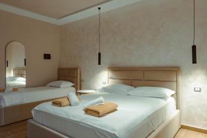 Voodi või voodid majutusasutuse DelMar All Inclusive toas