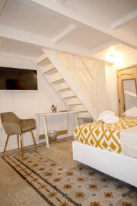 Un ou plusieurs lits dans un hébergement de l'établissement Miro B&B