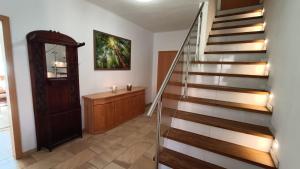 a stairway in a home with a wooden door at Ferienwohnung Emma Fliessau Zernien in Zernien