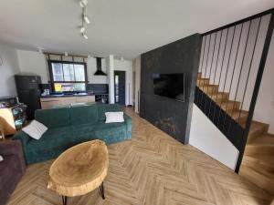 TV a/nebo společenská místnost v ubytování FLAUTA apartamenty