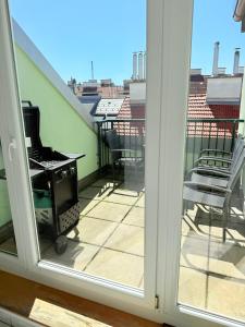 a view of a balcony with a stove at Dachterrasse für 4 Personen in Vienna