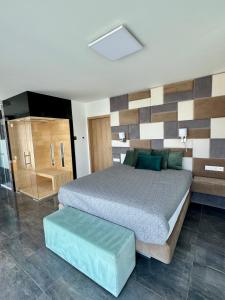 a bedroom with a bed in a room with at Villapark apartman A-B 12 in Fonyód