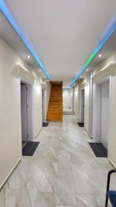 an empty hallway with a staircase in a building at Dragobia House & Table in Dragobi