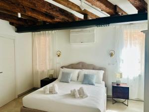 Rúm í herbergi á Casa Dolce Riva +13 myndir