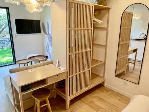 a home office with a desk and a mirror at La Rose des Sables suite 5 étoiles in Les Issambres +2 photos