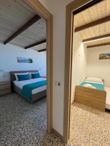 Postel nebo postele na pokoji v ubytování Nello House + 8 fotografií