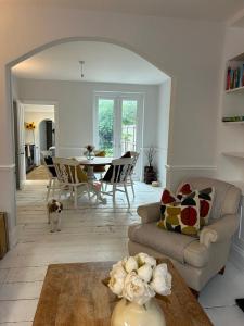 a living room with a couch and a table at Spacious Town house 2 bed 2 mins 2 beach in Deal