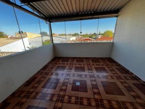 an empty room with a view of a balcony at Apto - Brasilândia do Sul - PR in Assis Chateaubriand